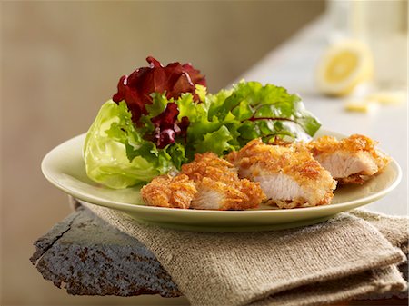 Turkey goujons with a cornflake crust and a mixed leaf salad Stock Photo - Premium Royalty-Free, Code: 659-06495072