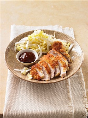 Breaded chicken breast with cabbage salad and barbecue sauce Stock Photo - Premium Royalty-Free, Code: 659-06495313