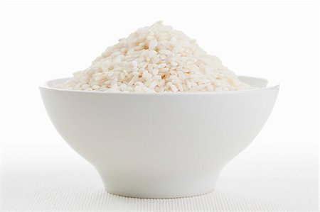 riz blanc - Round grain rice (risotto rice) in a white bowl Photographie de stock - Premium Libres de Droits, Code: 659-06495381