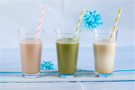 smoothie with fruits - A strawberry smoothie, a matcha smoothie and a lucuma smoothie Stock Photo - Premium Royalty-Free, Code: 659-06495443