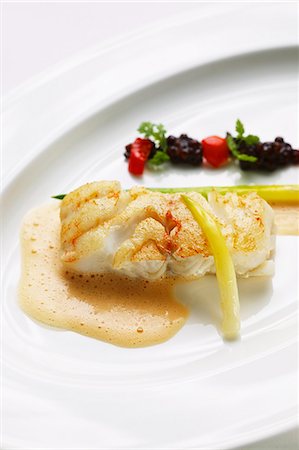 Fried cod with lentils, tomato broth and leek Stock Photo - Premium Royalty-Free, Code: 659-06495476