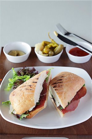 simsearch:659-06495132,k - A ham sandwich and mixed pickles Stock Photo - Premium Royalty-Free, Code: 659-06495586