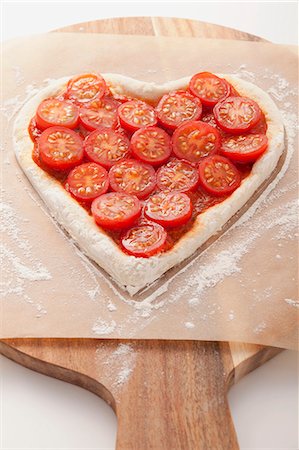 simsearch:659-06188391,k - A tomato cake on a piece of baking paper Stock Photo - Premium Royalty-Free, Code: 659-06495648