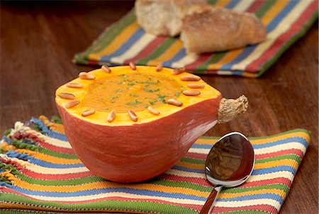 Pumpkin soup served in a hollowed out pumpkin Stock Photo - Premium Royalty-Free, Code: 659-06495788