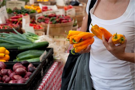 simsearch:659-06373254,k - Woman Holding Banana Peppers at a Farmer's Market Stock Photo - Premium Royalty-Free, Code: 659-06493685