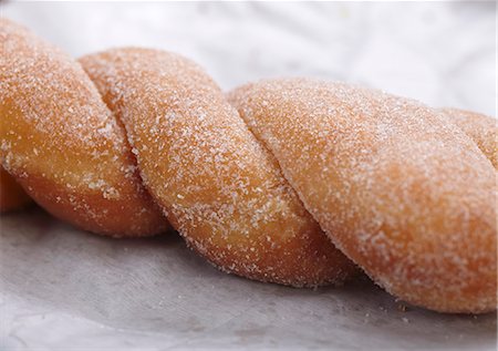 Sugared Twist Doughnut Stock Photo - Premium Royalty-Free, Code: 659-06493707