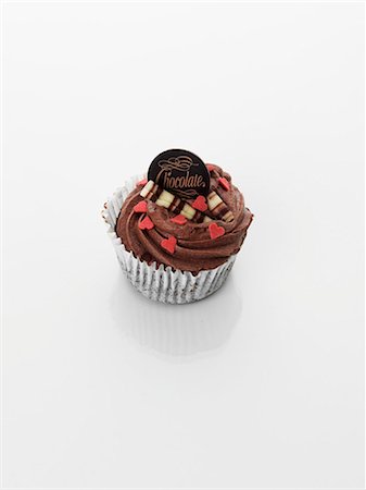 simsearch:659-06494271,k - A cupcake decorated with chocolate cream and hearts Stock Photo - Premium Royalty-Free, Code: 659-06493801