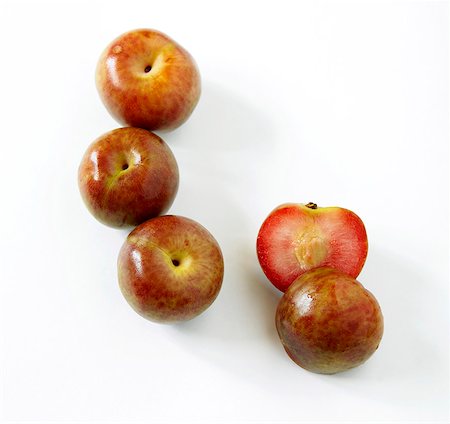 simsearch:659-06494422,k - Fresh Whole Loquat Fruit; One Halved; White Background Stock Photo - Premium Royalty-Free, Code: 659-06493818
