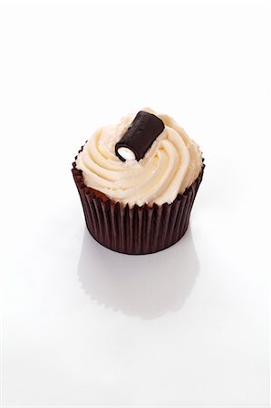 simsearch:659-06493804,k - A cupcake decorated with a liquorice bonbon Stock Photo - Premium Royalty-Free, Code: 659-06493850