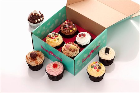 Various cupcakes in a box Stock Photo - Premium Royalty-Free, Code: 659-06493852