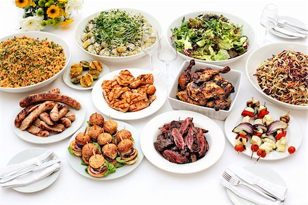 Sausages, chicken, couscous and salad on a buffet Stock Photo - Premium Royalty-Free, Code: 659-06493868