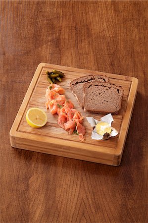 Smoked salmon, butter and wholemeal bread Stock Photo - Premium Royalty-Free, Code: 659-06493966