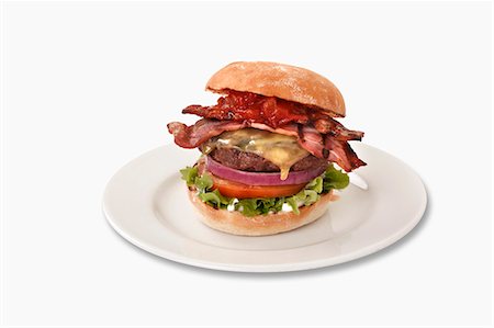 simsearch:400-04755691,k - Bacon Cheeseburger on Sesame Seed Bun; On Plate Stock Photo - Premium Royalty-Free, Code: 659-06493989