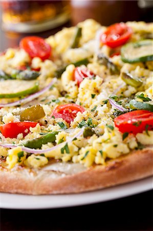 simsearch:659-01852978,k - Egg Pizza with Roasted Cherry Tomatoes, Capers, Pan Fried Zucchini and Asparagus, Red Onions and Parsley Stock Photo - Premium Royalty-Free, Code: 659-06670857