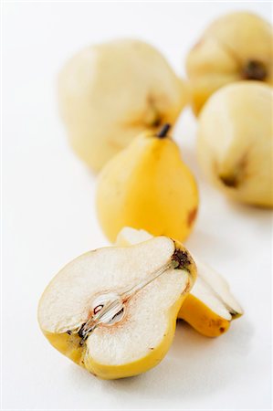 Quinces, whole and halved Stock Photo - Premium Royalty-Free, Code: 659-06670997