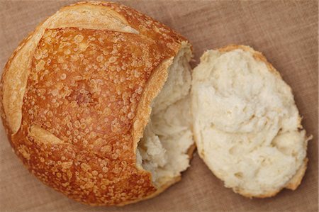 simsearch:659-08895672,k - Small Loaf of Sourdough Bread with the End Broken Off Photographie de stock - Premium Libres de Droits, Code: 659-06671025