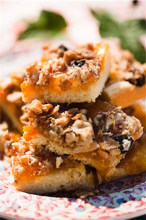 peach not people fruit - Pieces of Peach Jam, Goat Cheese, Nut and Blueberry Pizza; Stacked; Close Up Stock Photo - Premium Royalty-Free, Code: 659-06671020