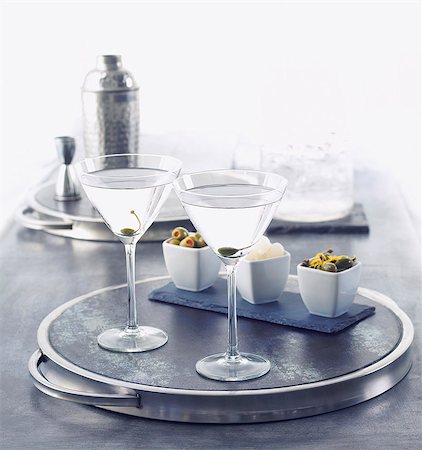 Two Martinis on a Silver Tray; Olives and Onions in Small Bowls; Cocktail Shaker Stock Photo - Premium Royalty-Free, Code: 659-06671060