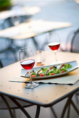 An aperitif of red wine with anchovy and mozzarella on salad leaves Stock Photo - Premium Royalty-Free, Code: 659-06671154