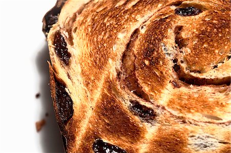 Toasted Slice of Cinnamon Raisin Bread Stock Photo - Premium Royalty-Free, Code: 659-06671181