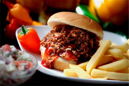 sandwich and chips - Chopped Barbecue Beef Sandwich on a Bun with French Fries Stock Photo - Premium Royalty-Free, Code: 659-06671193