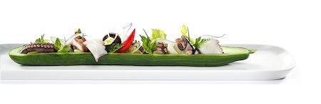 squid - Octopus salad arranged in half a cucumber Foto de stock - Sin royalties Premium, Código: 659-06671276