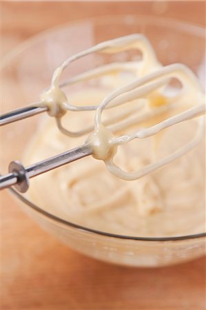 Cake mixture in a glass bowl and on the whisks of the mixer Stock Photo - Premium Royalty-Free, Code: 659-06671335