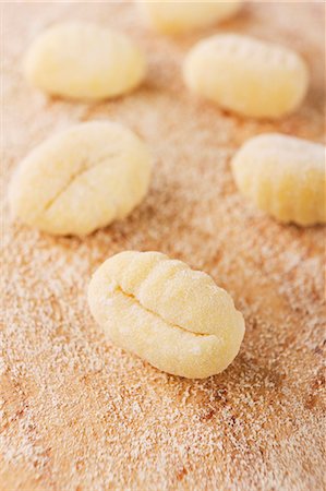 A number of fresh gnocchi with flour Stock Photo - Premium Royalty-Free, Code: 659-06671435