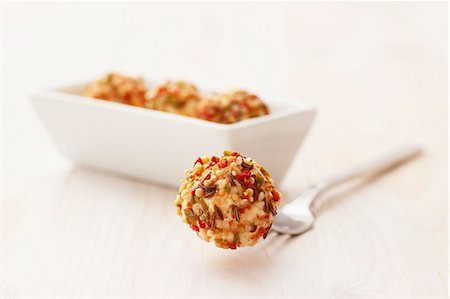 Tangy cream cheese balls on a fork and in a small oblong dish Stock Photo - Premium Royalty-Free, Code: 659-06671519
