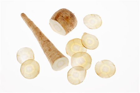 A parsnip with some slices cut from the middle Stock Photo - Premium Royalty-Free, Code: 659-06671528