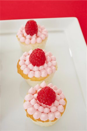 simsearch:659-06151130,k - Three Mini Raspberry Cupcakes Stock Photo - Premium Royalty-Free, Code: 659-06671608