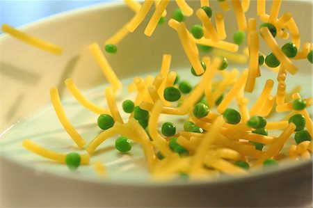 simsearch:659-06671134,k - Pasta and peas falling into a casserole dish Stock Photo - Premium Royalty-Free, Code: 659-06904006