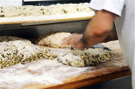 Bread dough with olives being kneaded Stock Photo - Premium Royalty-Free, Code: 659-06900780