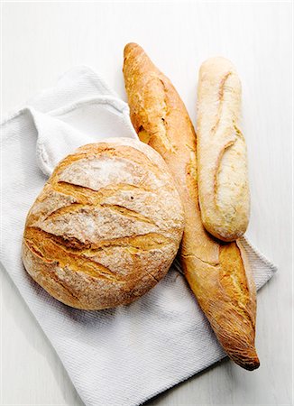 french breads - Boule, Ficelle und Baguette (French white bread) Foto de stock - Sin royalties Premium, Código: 659-06900864