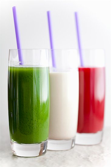 Three Assorted Smoothies in Glasses with Straws Stock Photo - Premium Royalty-Free, Image code: 659-06901231