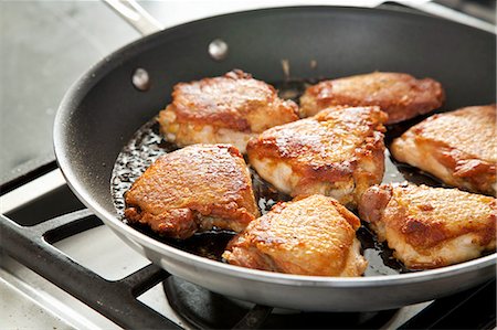 pan frying - Chicken Cooking in a Skillet Stock Photo - Premium Royalty-Free, Code: 659-06901277
