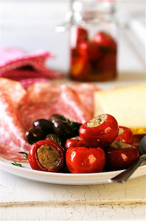 sausage salami - Antipasti platter with stuffed chilli peppers, olives, meat and cheese Stock Photo - Premium Royalty-Free, Code: 659-06901452