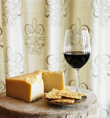 simsearch:659-06902579,k - Cheddar Cheese, Crackers and a Glass of Red Wine on a Small Table Stock Photo - Premium Royalty-Free, Code: 659-06901466