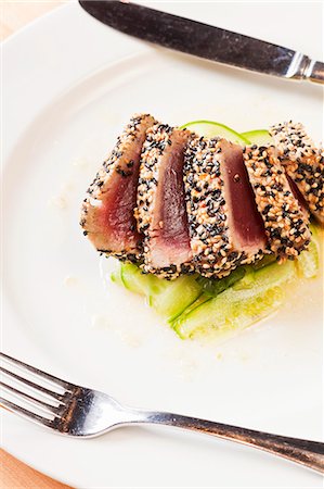 Sesame Encrusted Seared Ahi Tuna in a Spicy Cucumber and Lime Vinaigrette Stock Photo - Premium Royalty-Free, Code: 659-06901469