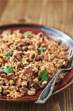 french bean dish - Rice and black eyed peas with cumin and mustard seeds topped with fresh cilantro Stock Photo - Premium Royalty-Free, Code: 659-06901490