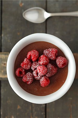 pudding - Chocolate pudding topped with raspberries (view from above) Stock Photo - Premium Royalty-Free, Code: 659-06901713