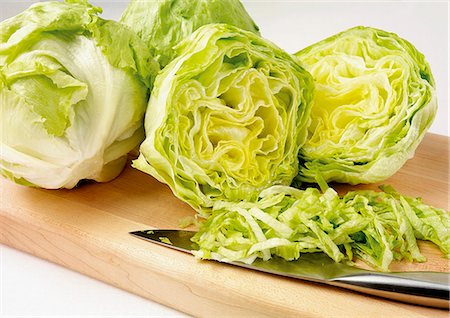 photograph of lettuce - Iceberg lettuce, partly sliced into strips Stock Photo - Premium Royalty-Free, Code: 659-06901743