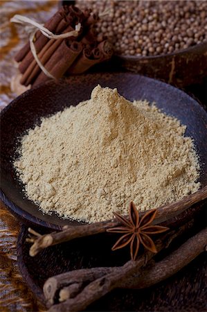 Liquorice root powder in a bowl, surrounded by spices Stock Photo - Premium Royalty-Free, Code: 659-06901898