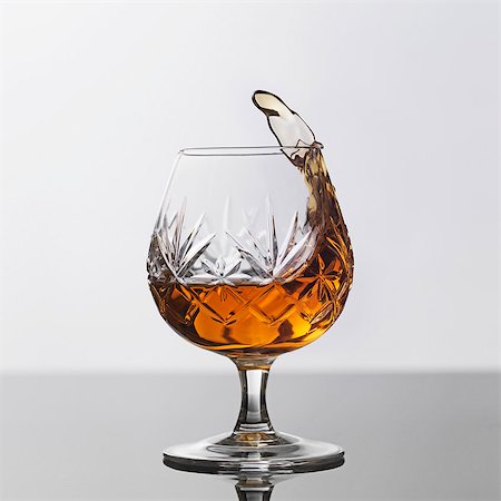 splashing drink in glass - A glass of brandy Stock Photo - Premium Royalty-Free, Code: 659-06902077