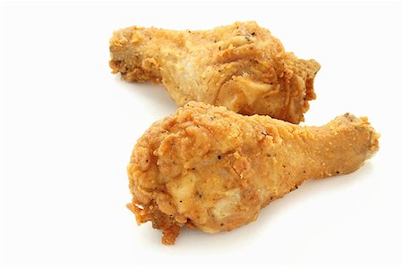 pollo (alimento) - Two deep-fried chicken legs Foto de stock - Sin royalties Premium, Código: 659-06902124