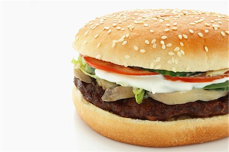 schimmel - A hamburger with mushrooms, mozzarella and tomatoes Stockbilder - Premium RF Lizenzfrei, Bildnummer: 659-06902120