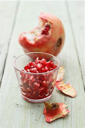 exotic fruit bowl - Pomegranate seeds and a pomegranate Stock Photo - Premium Royalty-Free, Code: 659-06902210