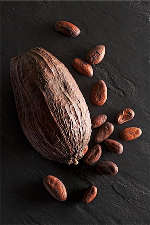 food black background - A cocoa pod and cocoa beans Stock Photo - Premium Royalty-Free, Code: 659-06902229