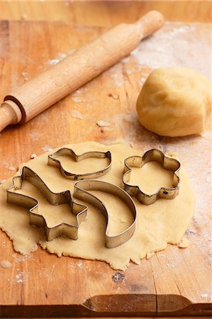 festive biscuits stars - Cutting out biscuits Stock Photo - Premium Royalty-Free, Code: 659-06902242