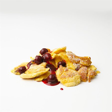 fruit white background not people - Kaiserschmarren (sweet cut up pancakes) with cherry compote in front of white background Stock Photo - Premium Royalty-Free, Code: 659-06902331